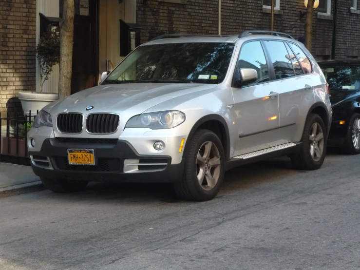 a silver car parked on the side of a road