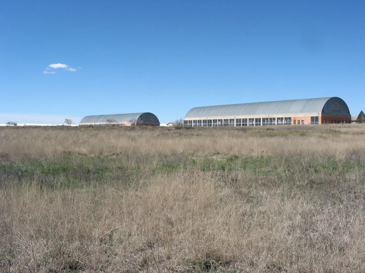 the large building is on an empty field