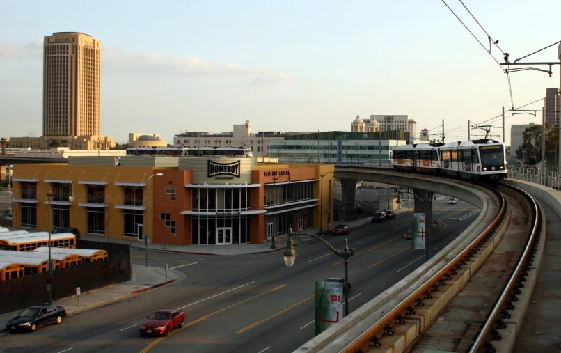 the trolley moves along a track through a downtown area