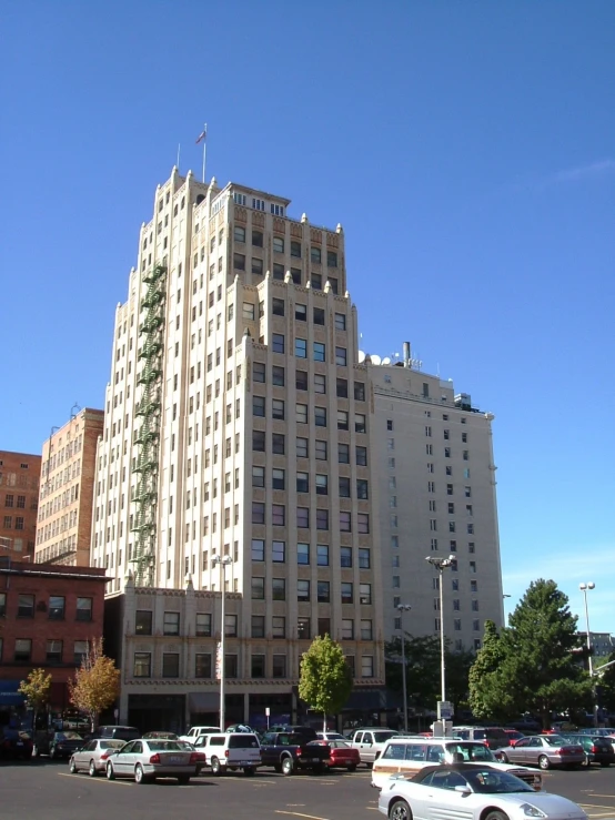 several cars parked in front of an old building