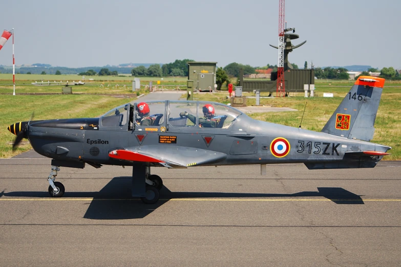 the fighter jet is parked on the runway