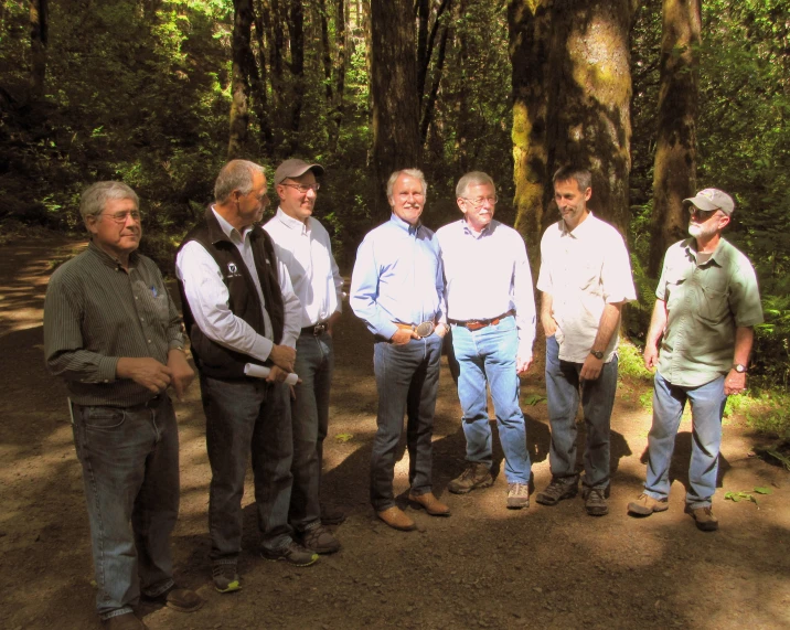 men stand in the forest for a picture