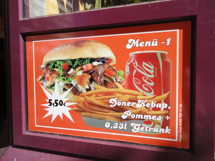 a menu for a burger restaurant is displayed in front of a window