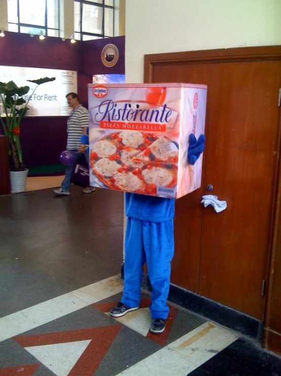 a person holding up a box of food