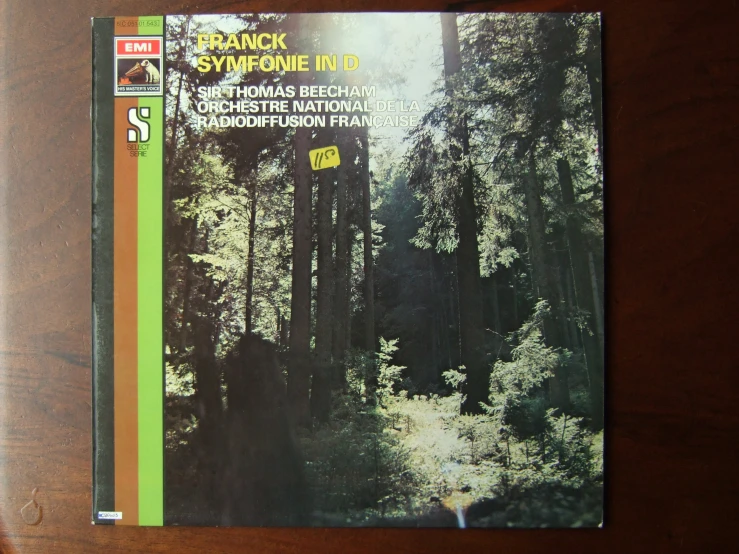a po of a forest on the front of a vinyl album