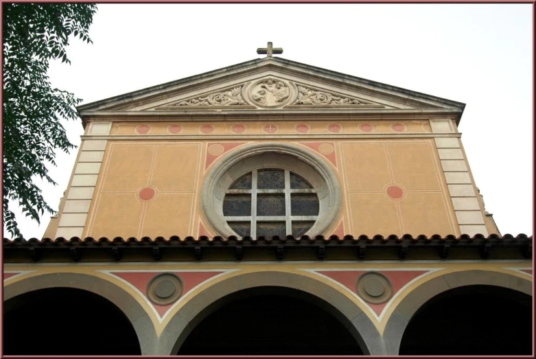 the roof of a building with arches and a window