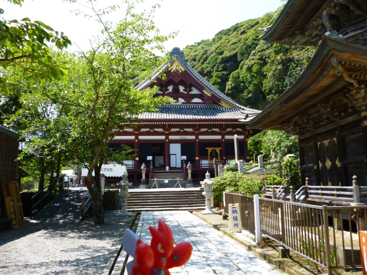 a building in the foreground with stairs leading up