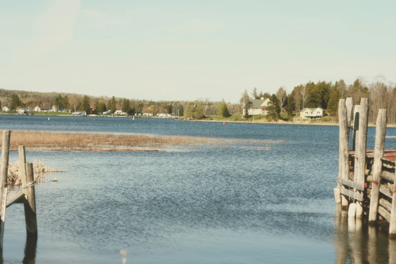 the view over a calm lake in a residential area