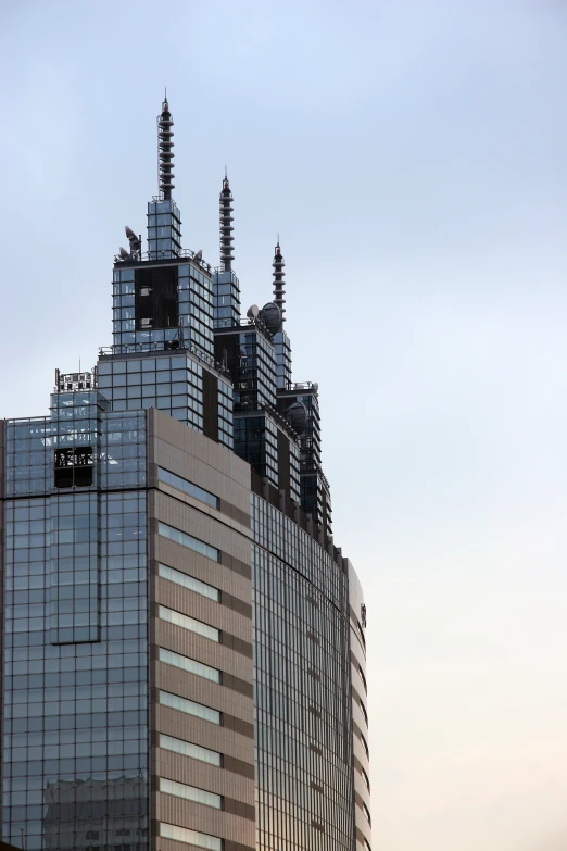 a tall building with two clocks on the top of it