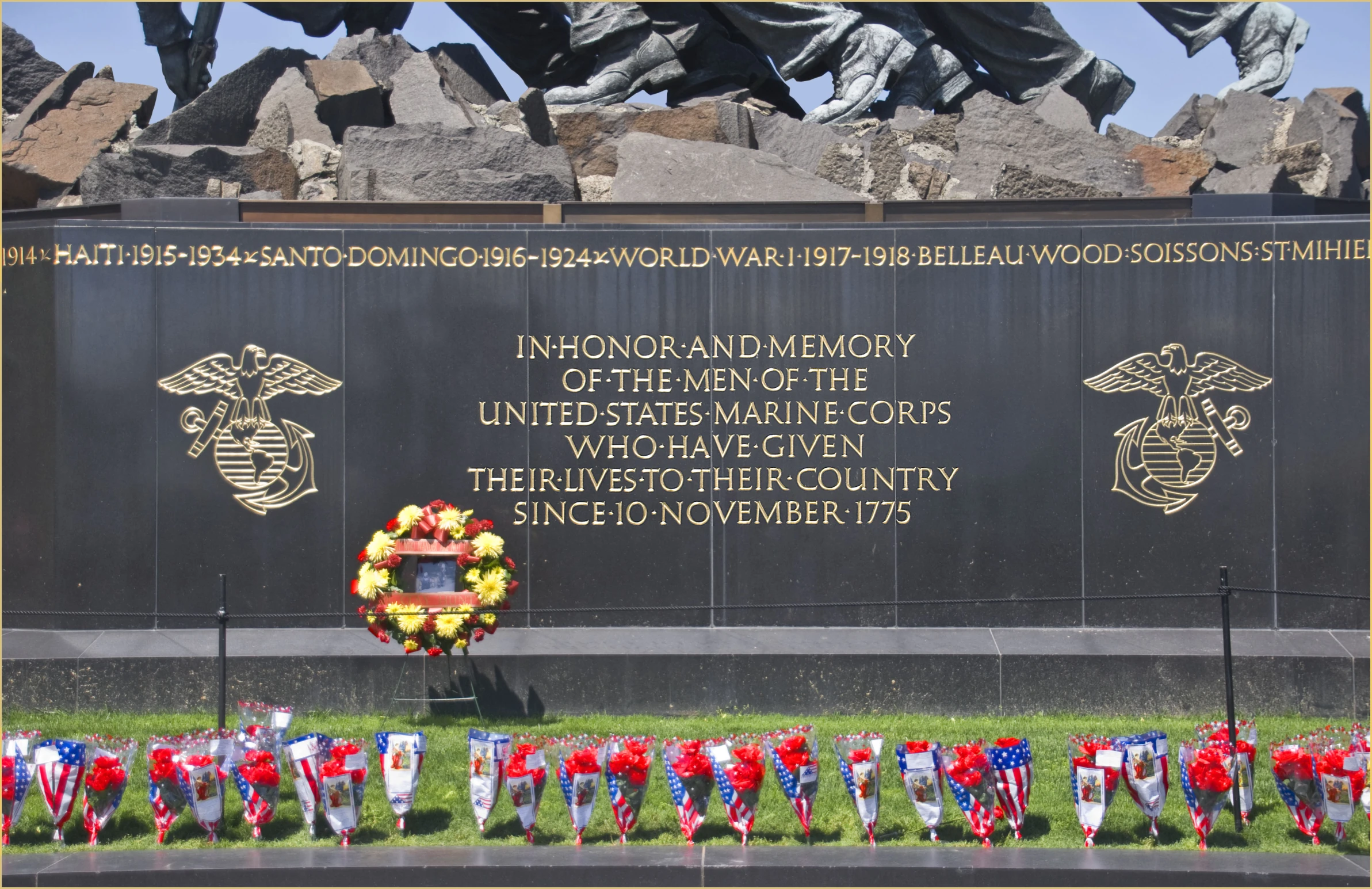 flowers are placed on the memorial wall for those who fought