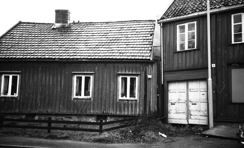 black and white pograph of two wooden buildings