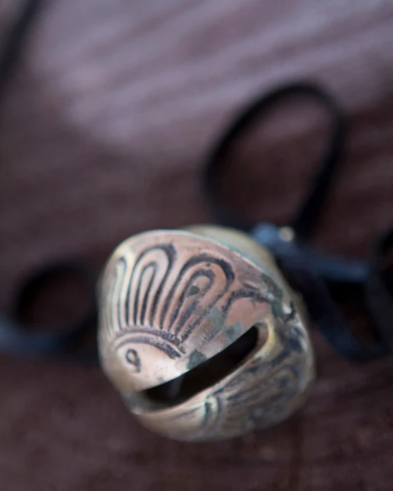 a ring with ornate designs is sitting on the floor