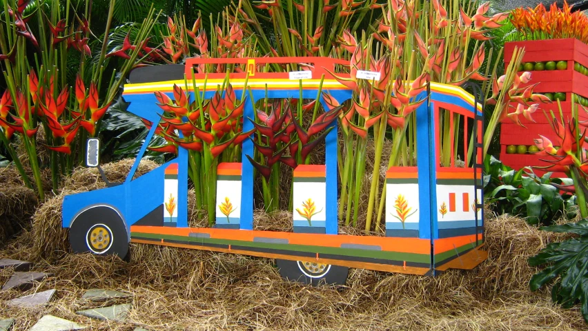 a decorative bus with several planter's in the shape of the back of it