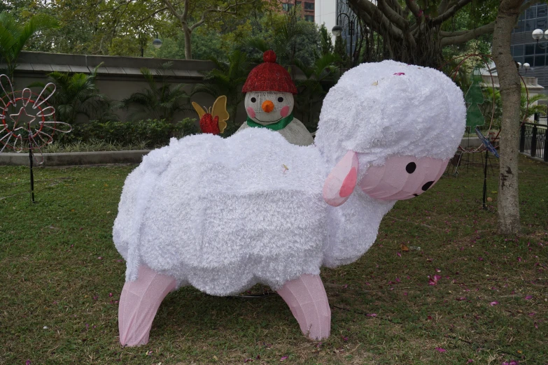 this is a giant fake sheep in the grass