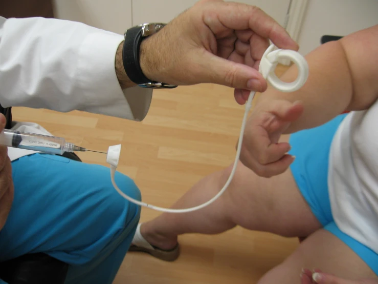 a doctor examining a woman's stomach with a stethoscope