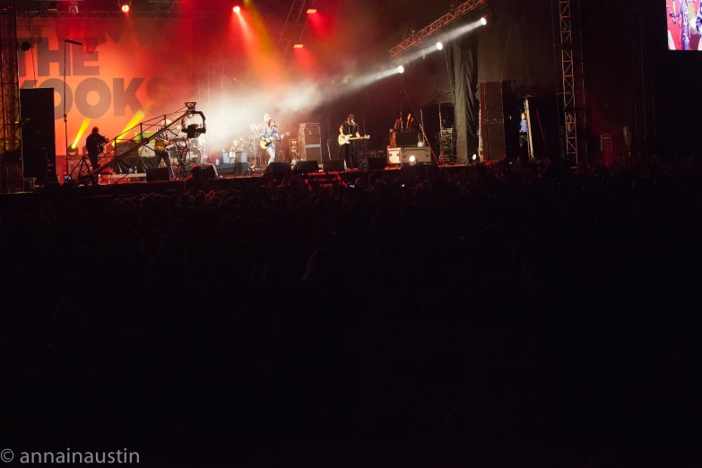 an array of musical instruments on stage lit up by red and blue lights