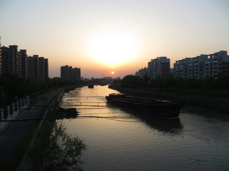 the sun is shining over some city's water