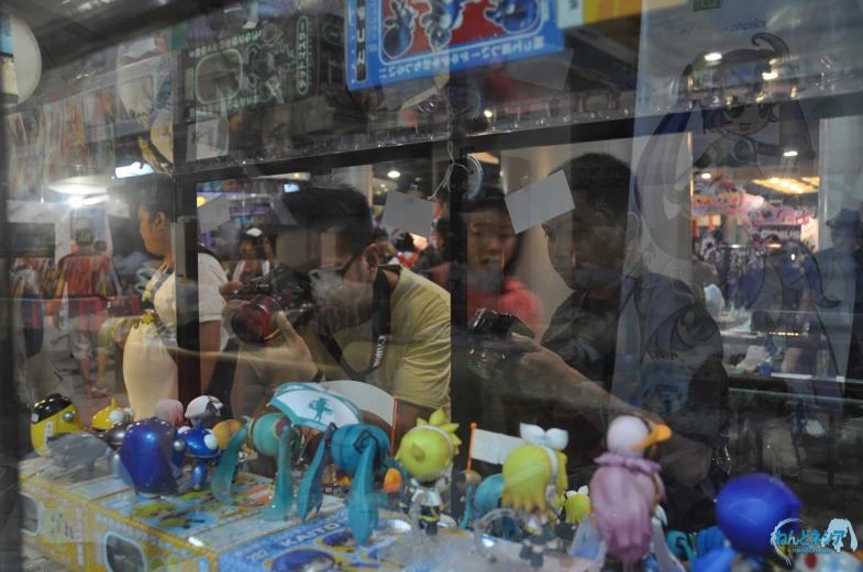 a couple of people looking in a shop window