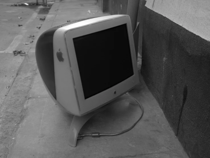 a black and white image of an old television