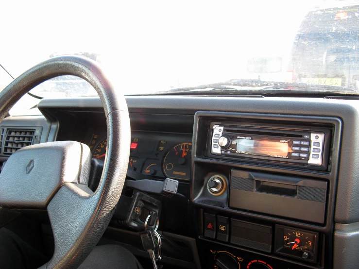 there is a car that has a steering wheel on the dashboard