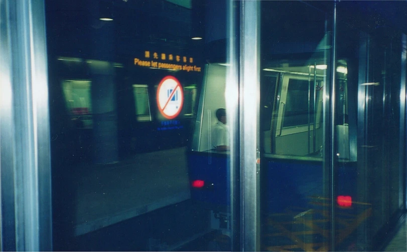 a train on a track at a subway stop