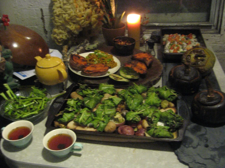 a table filled with food and a lit candle