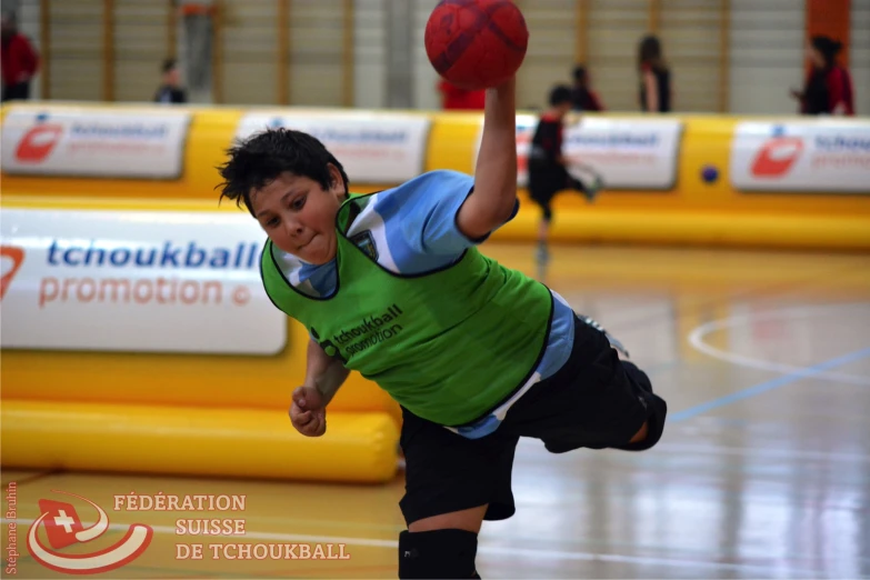 a man with a basketball in his hand is on the court