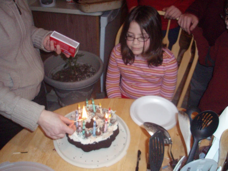 a child at a birthday party blow out the candles