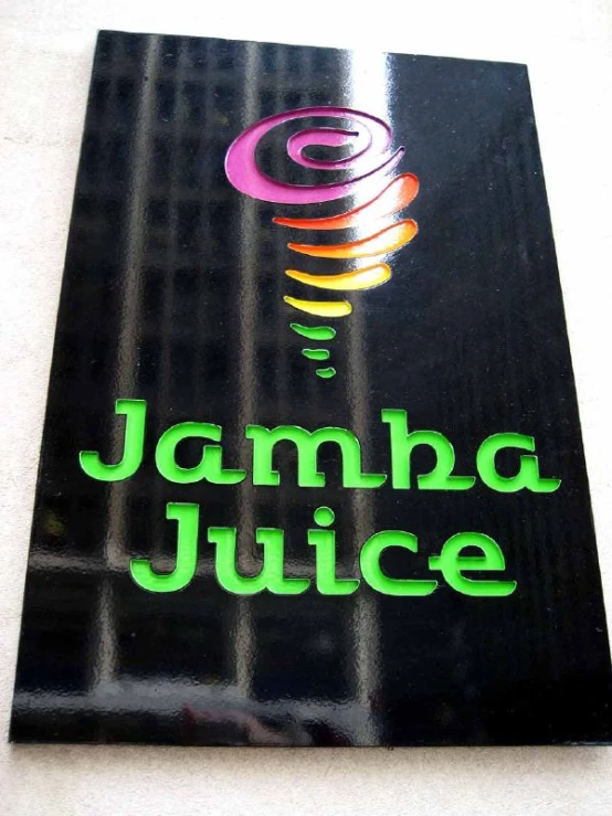 the logo of jamba juice, on a black card board