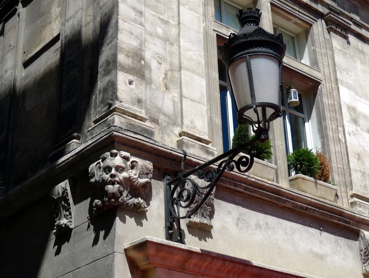 the corner of a building with flowers on it