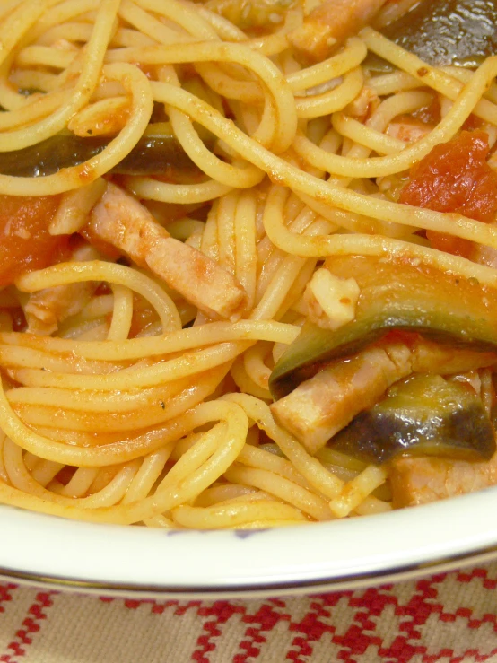 a plate full of spaghetti with various different ingredients