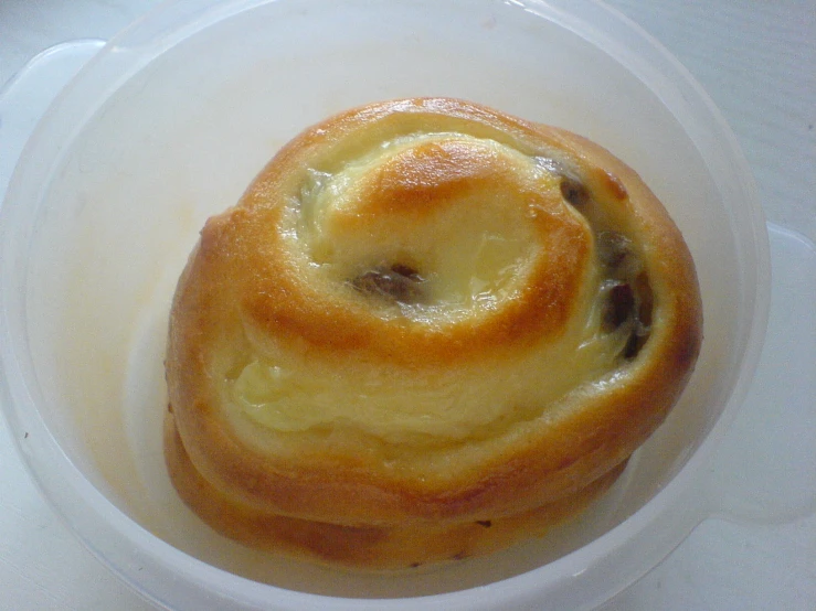 small bread sits in a bowl on a table