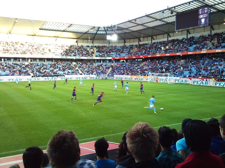 a view of an arena filled with spectators at a soccer game