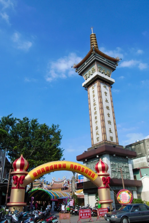 large statue on the side of the road in an asian city