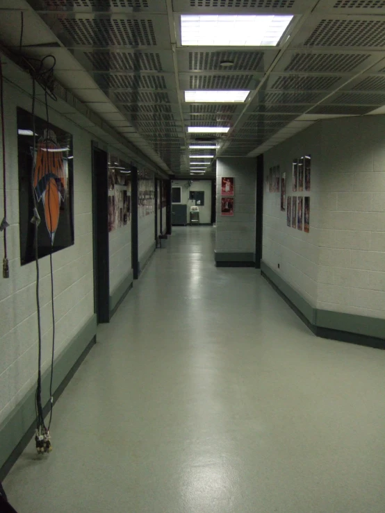 a long hallway between two lockers is pictured