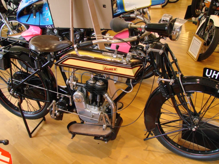 a old model motorcycle on display in a museum