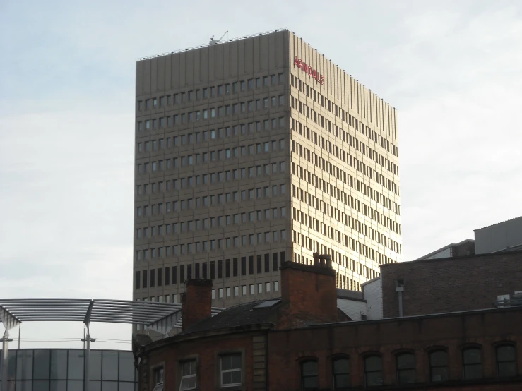 some buildings and a very tall tower in the middle