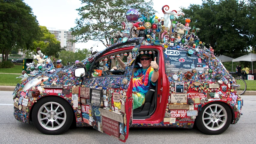 a person is driving in a decorated car