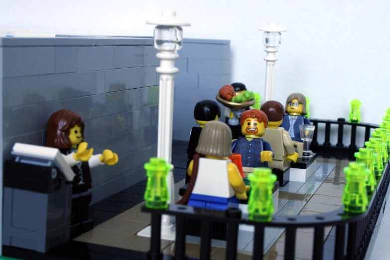 a lego restaurant with people inside, eating and talking