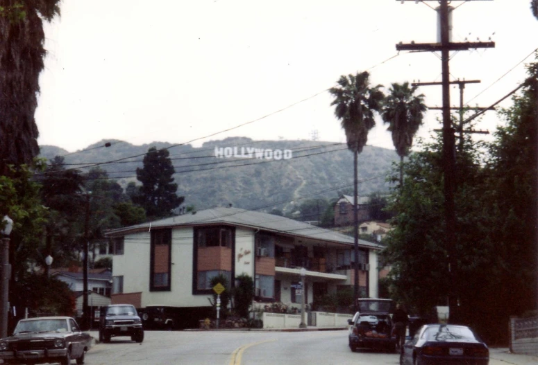 a view of a city street with cars on the road