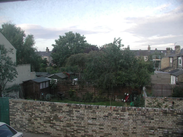 a brick wall in front of some houses