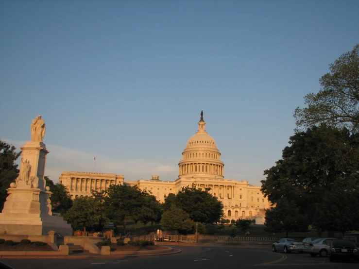 the u s capitol building seen from across the street