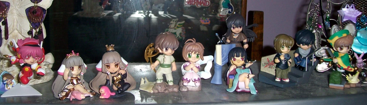 some anime figurines on a counter top