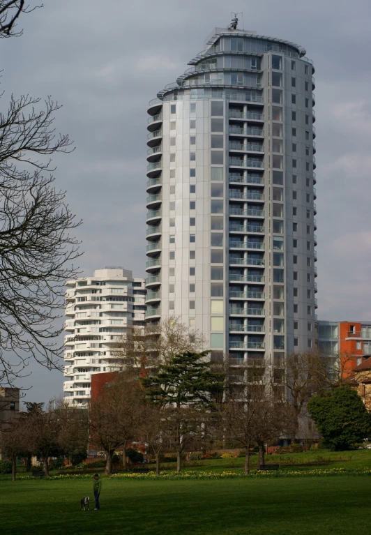 a tall building sitting in the middle of a park