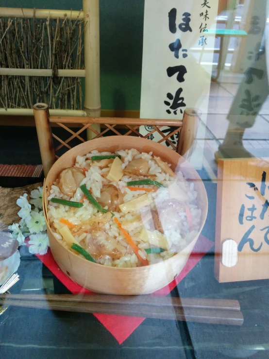 there is a bowl full of rice, on display