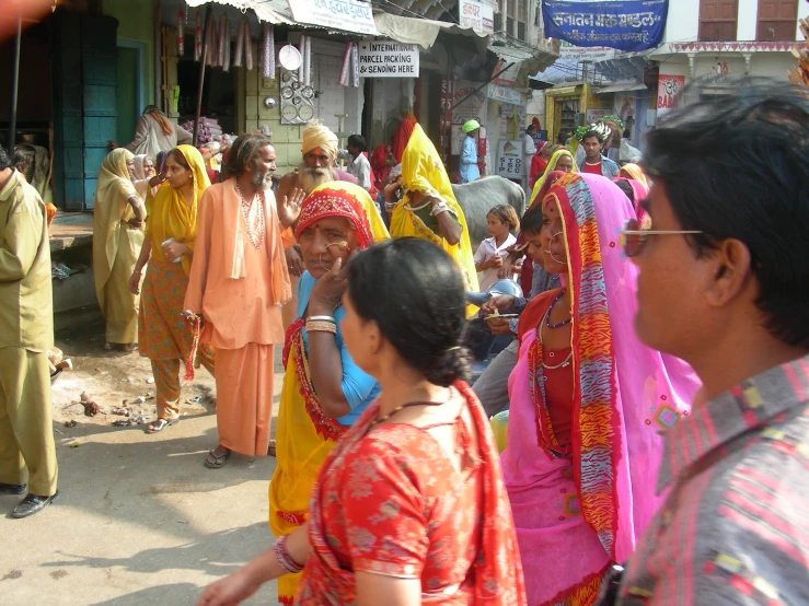 a large crowd of people dressed in indian clothing