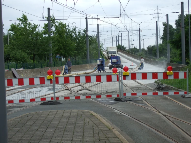 some men are repairing a train track