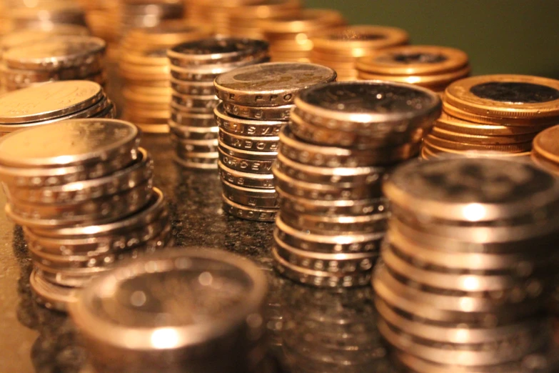 several stacks of coins are stacked on each other