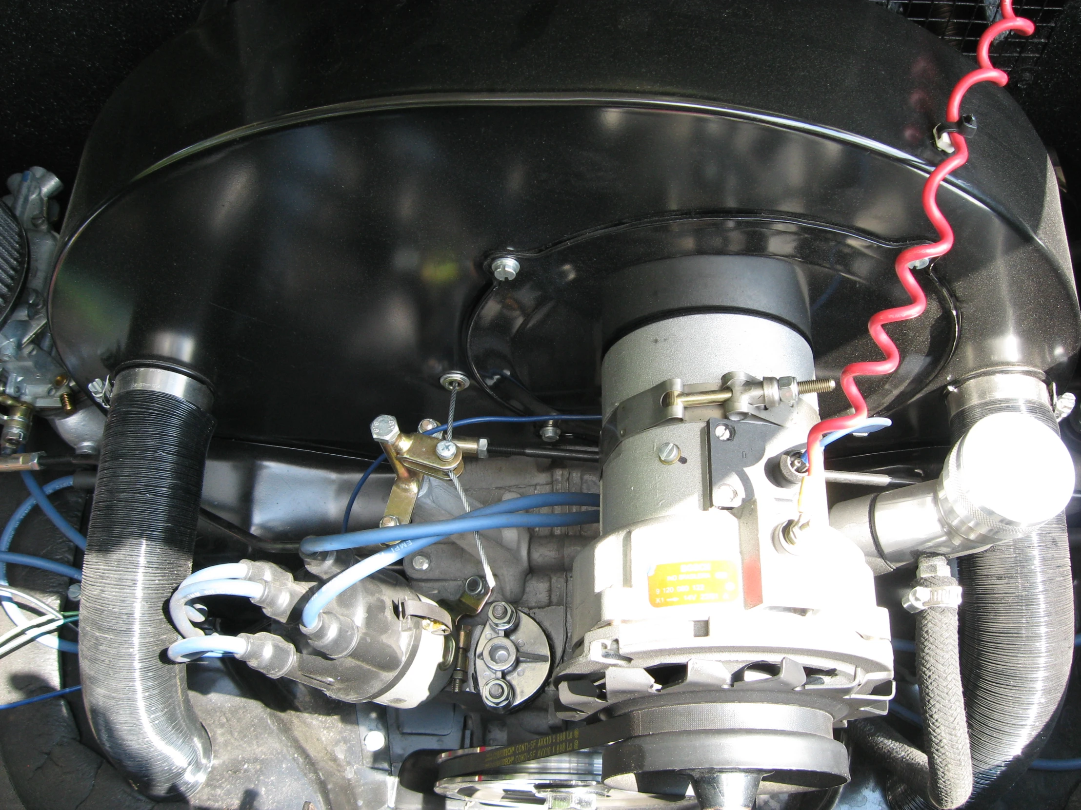 a engine from an automobile with wires and switches