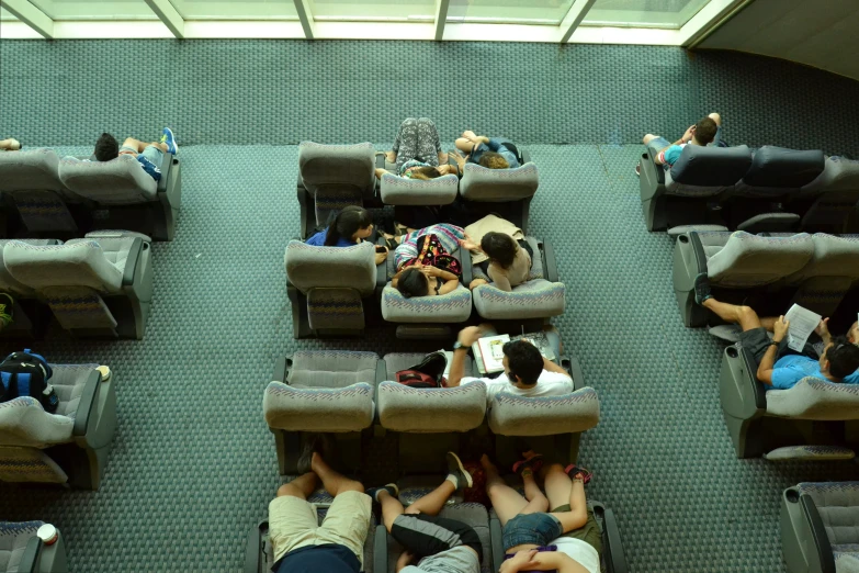 a couple laying on top of a green couch